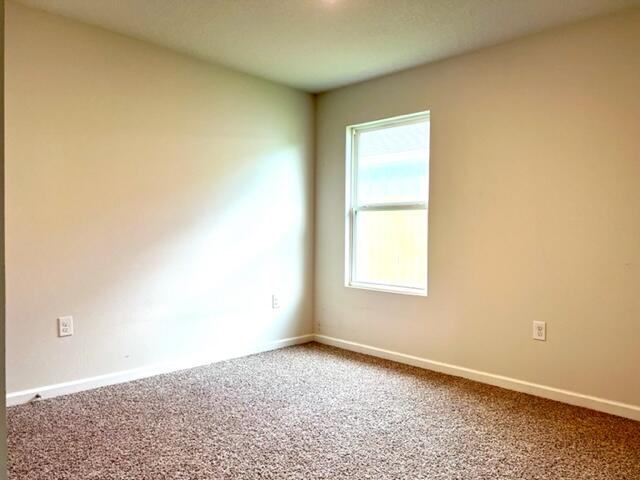 209 Laurel Hill Street Crestview, FL 32539 - Photo 11 of 24 an empty room with a window