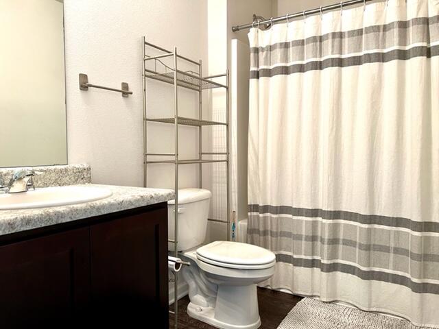 209 Laurel Hill Street Crestview, FL 32539 - Photo 12 of 24 a bathroom with a granite countertop sink toilet and shower