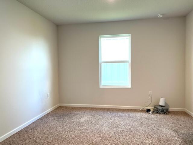 209 Laurel Hill Street Crestview, FL 32539 - Photo 13 of 24 an empty room with a window