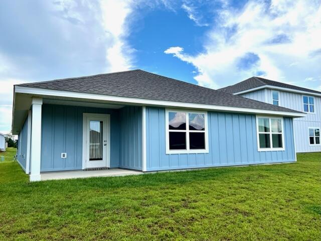 209 Laurel Hill Street Crestview, FL 32539 - Photo 17 of 24 a front view of a house with a garden