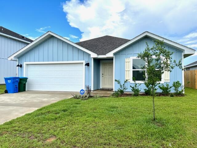 209 Laurel Hill Street Crestview, FL 32539 - Photo 20 of 24 a front view of house with yard and green space