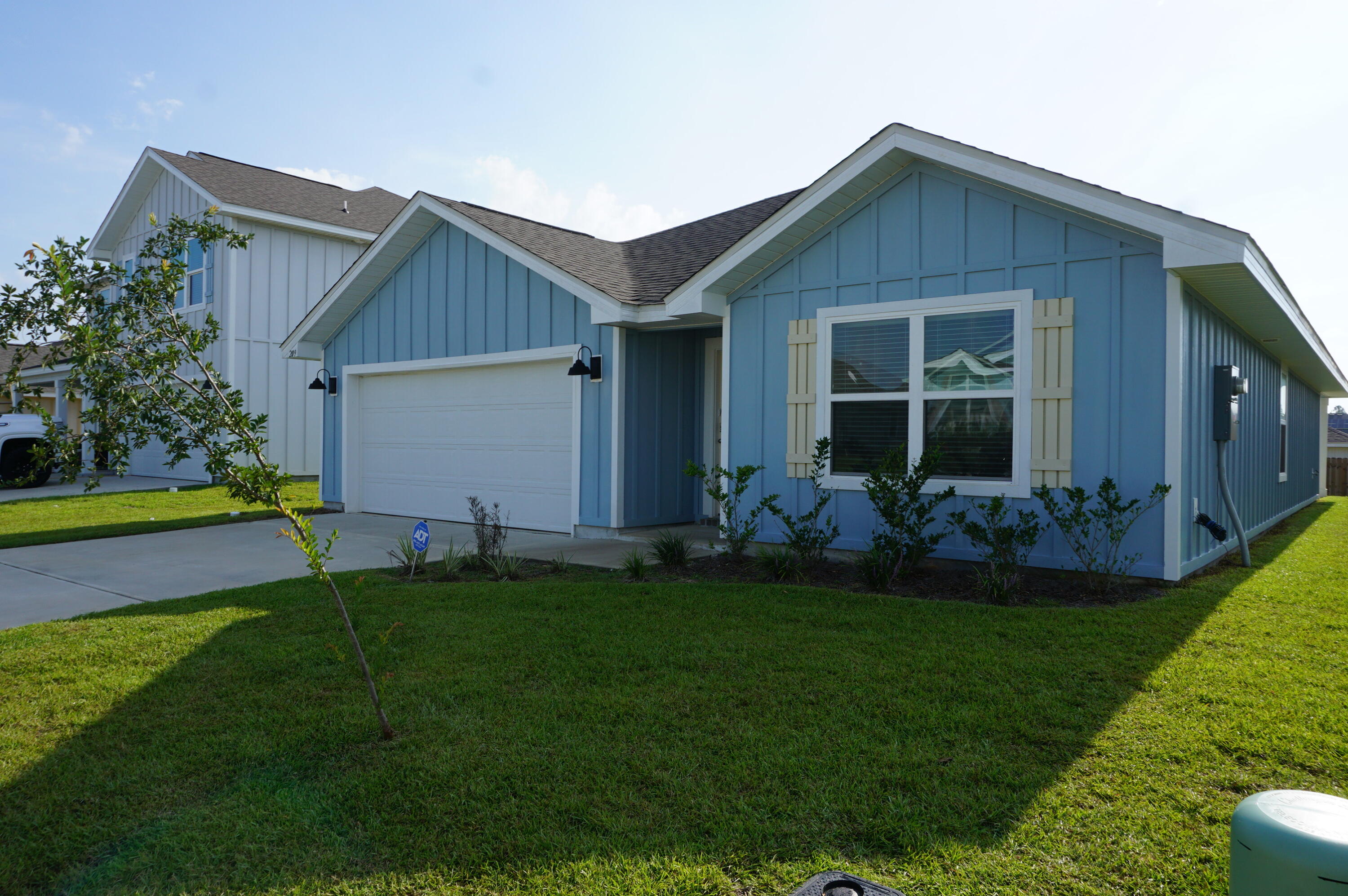 209 Laurel Hill Street Crestview, FL 32539 - Photo 2 of 24 a front view of house with yard and outdoor seating