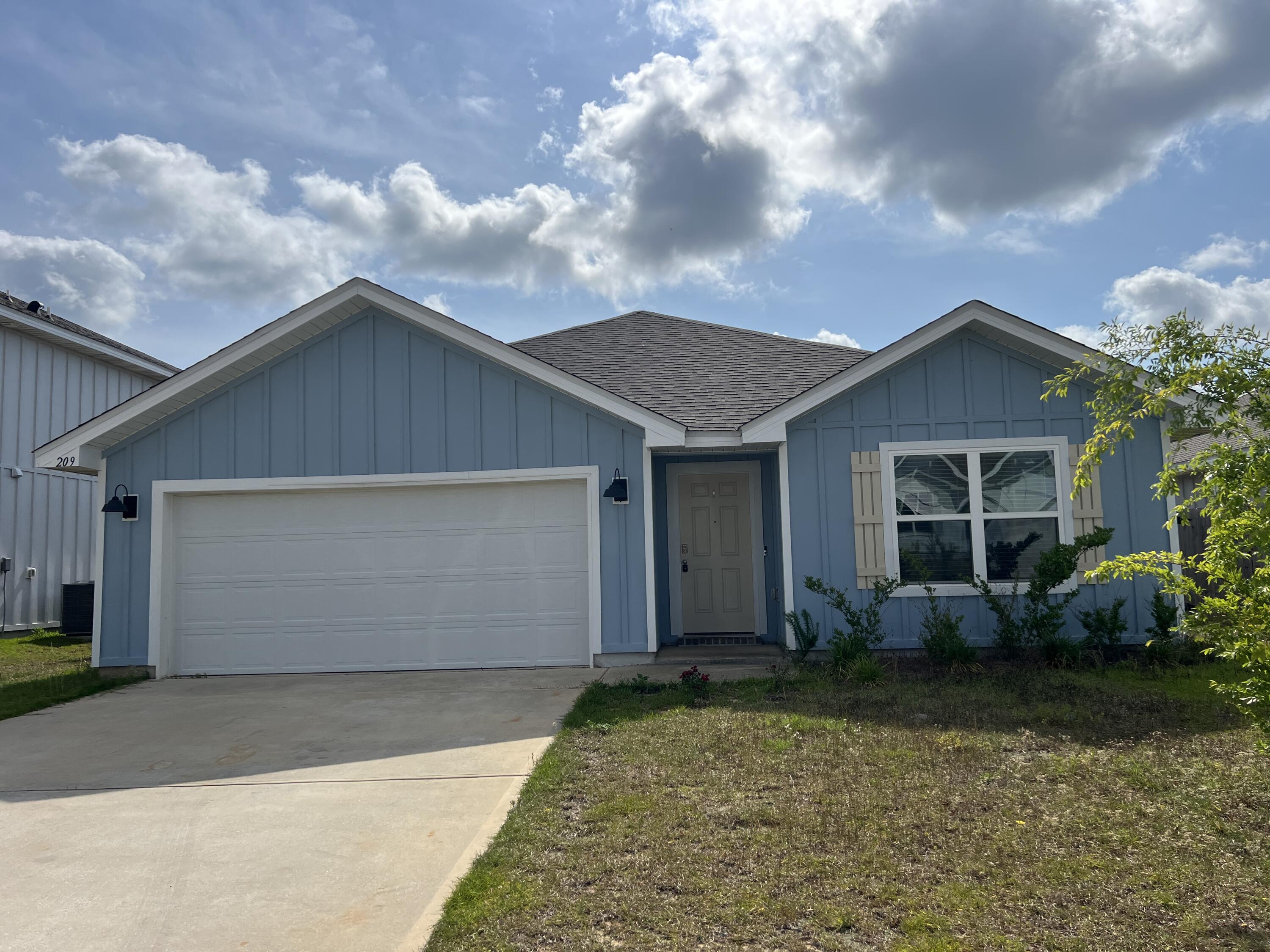 209 Laurel Hill Street Crestview, FL 32539 - Photo 24 of 24 a front view of house with garden