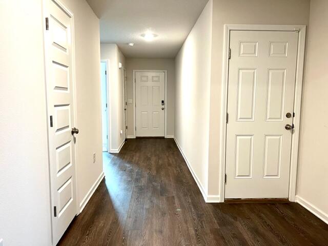 209 Laurel Hill Street Crestview, FL 32539 - Photo 4 of 24 a view of a hallway with wooden floor