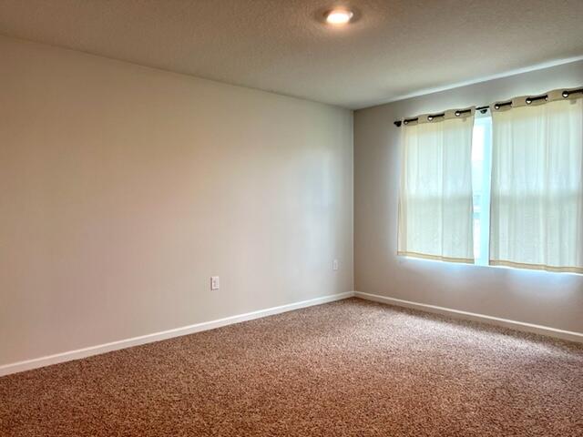 209 Laurel Hill Street Crestview, FL 32539 - Photo 9 of 24 a view of an empty room with a window