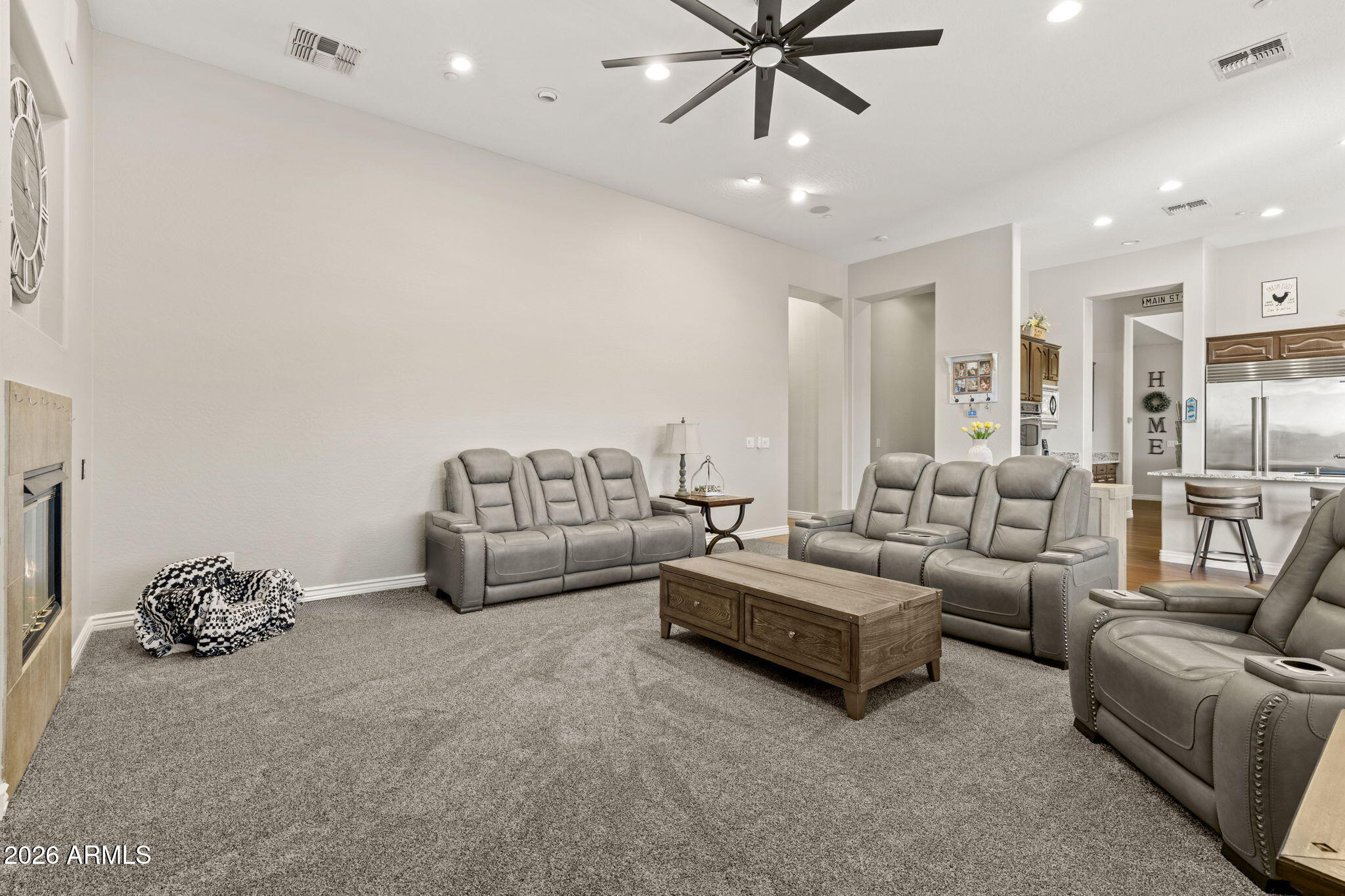 41619 North River Bend Road Anthem, AZ 85086 - Photo 44 of 84 a living room with furniture and a chandelier