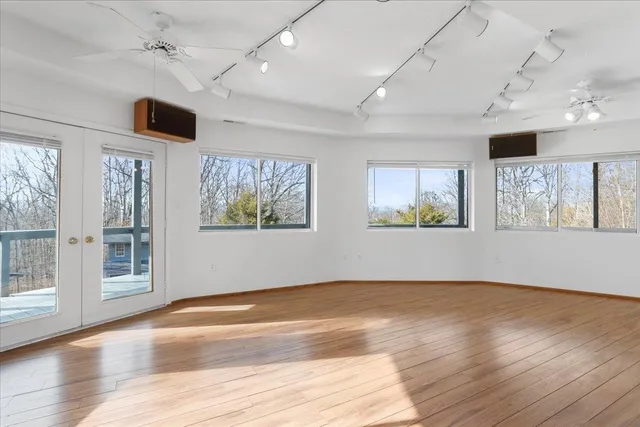 a view of balcony with wooden floor