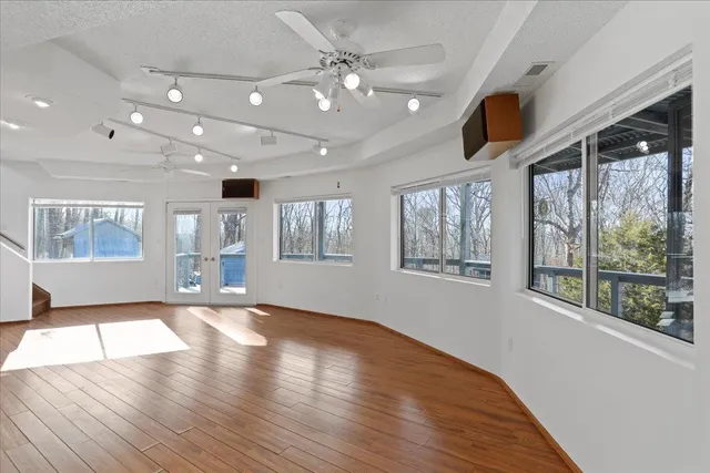 a view of a balcony with wooden floor