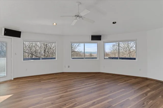 a bathroom with a granite countertop sink a toilet and shower