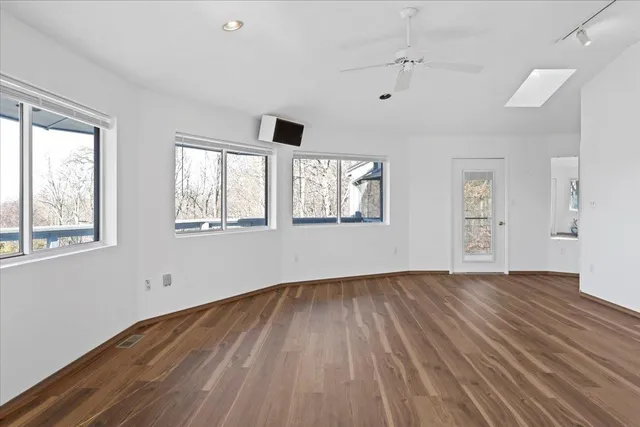 a bathroom with a toilet sink and cabinets