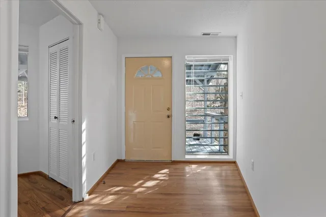 a kitchen with kitchen island white cabinets and chandelier