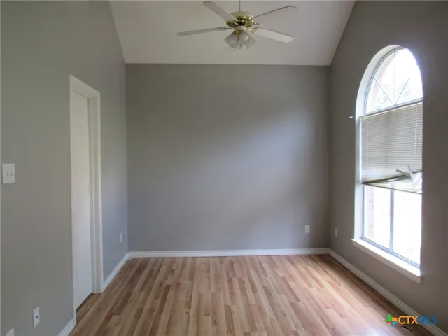an empty room that has a window