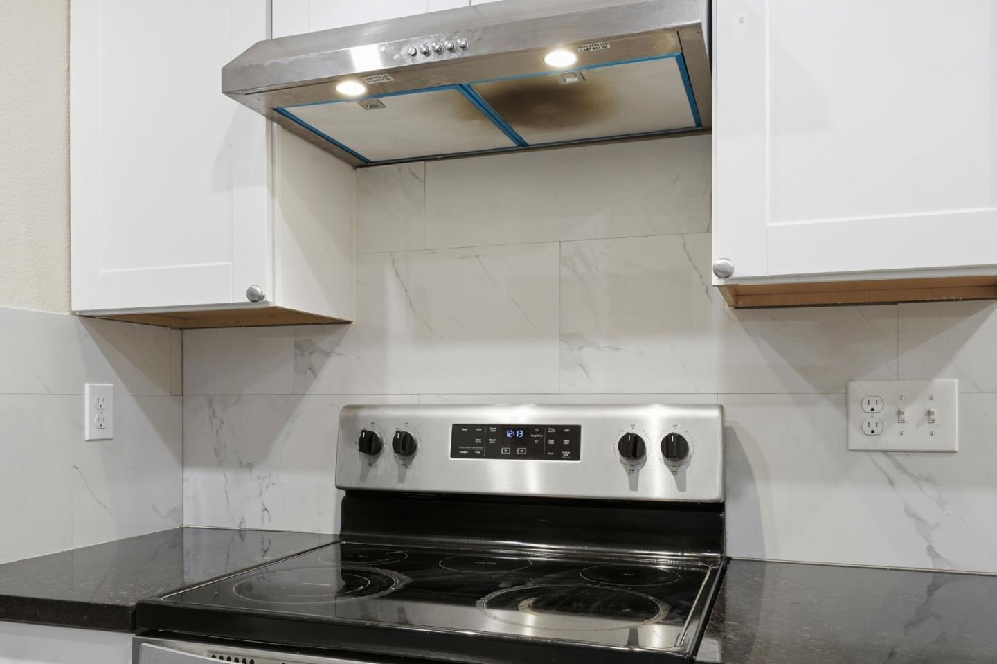 7283 Florin Road, Unit 8 Sacramento, CA 95828 - Photo 16 of 35 a stove top oven sitting inside of a kitchen