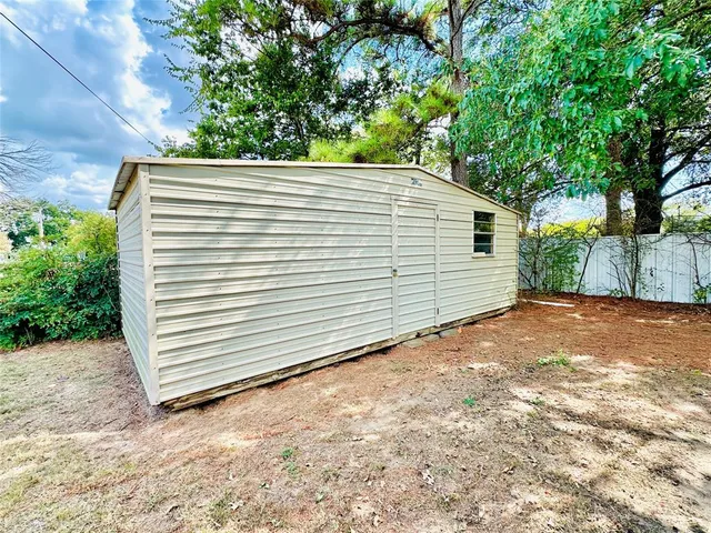 a view of a room with wooden floor and chair