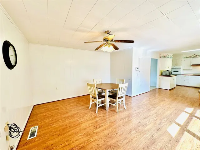 a dining room with a table and chairs