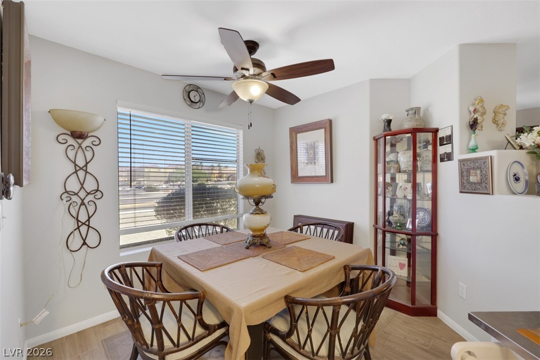 698 South Racetrack Road, Unit 1614 Henderson, NV 89015 - Photo 19 of 35 An inviting dining area features a large window, offering a view of the outside.