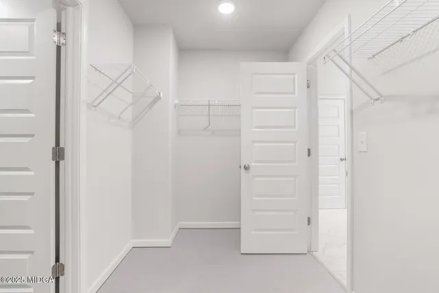 a view of an empty walk in closet