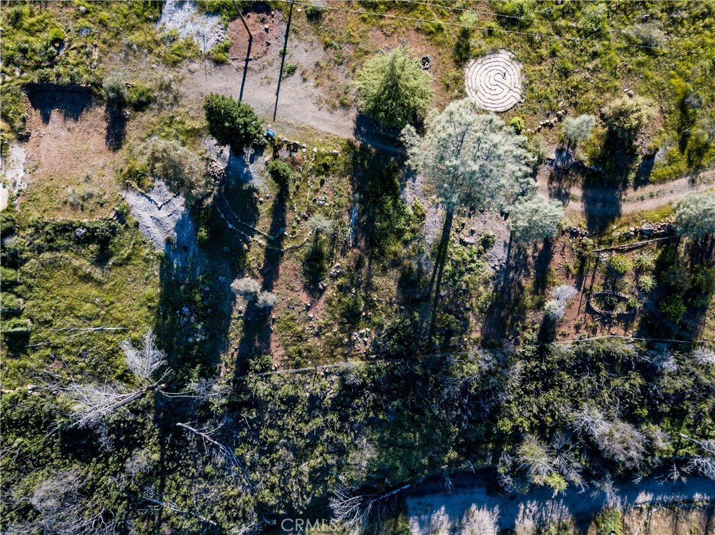 21541 Yankee Valley Road Hidden Valley Lake, CA 95467 - Photo 16 of 75 a view of a house with a yard and garden