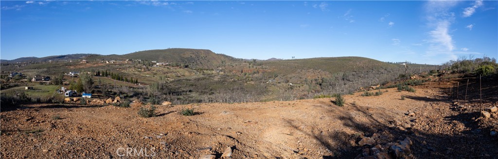 21541 Yankee Valley Road Hidden Valley Lake, CA 95467 - Photo 53 of 75 a view of a dry yard with mountains in the background