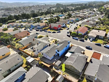 an aerial view of a city with lots of residential buildings