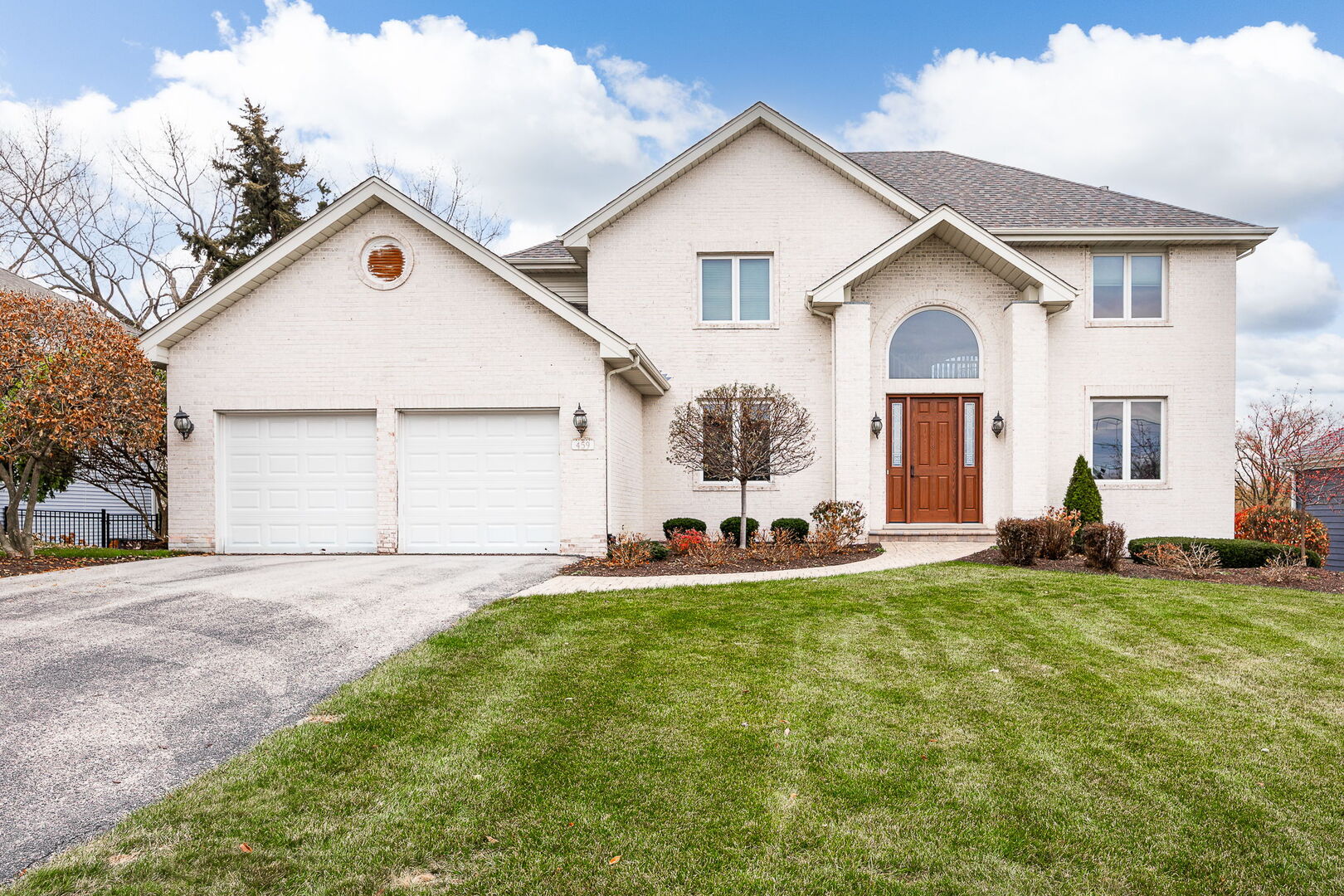 a view of a house with a yard and garage