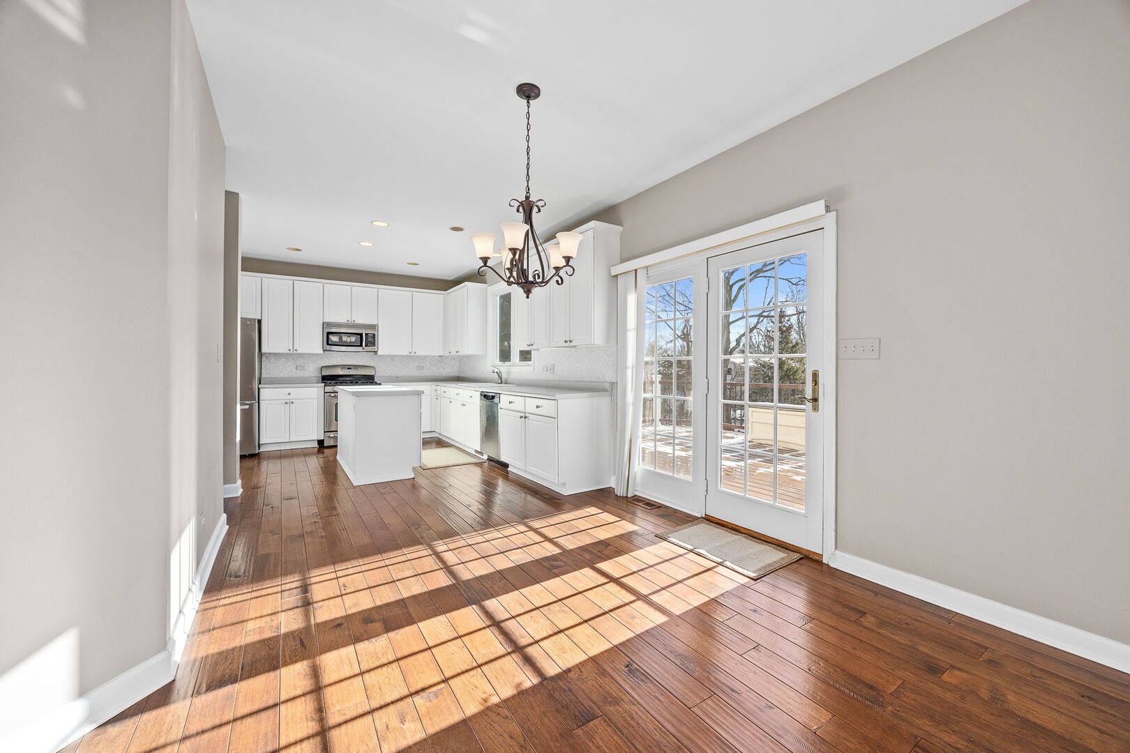 459 59th Street Lisle, IL 60532 - Photo 17 of 57 a living room with stainless steel appliances kitchen island granite countertop furniture and a wooden floor