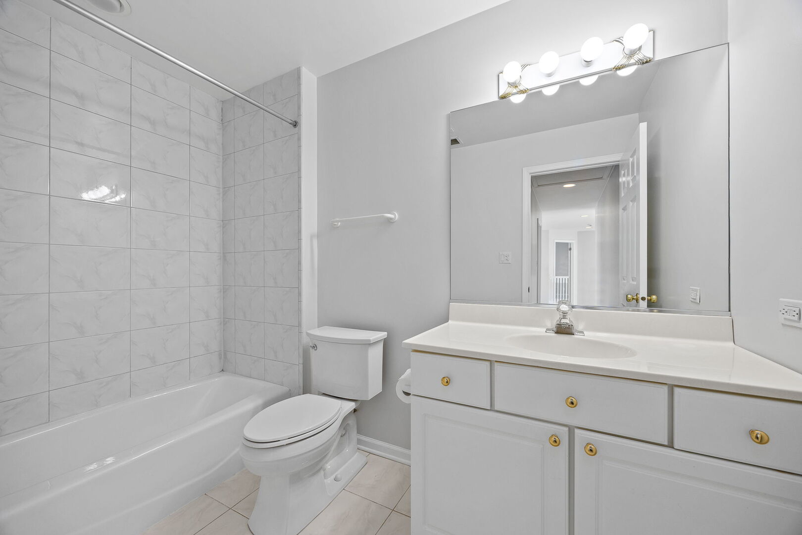 459 59th Street Lisle, IL 60532 - Photo 35 of 57 a bathroom with a sink a toilet and shower