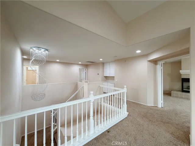 a view of a livingroom with a fireplace and window