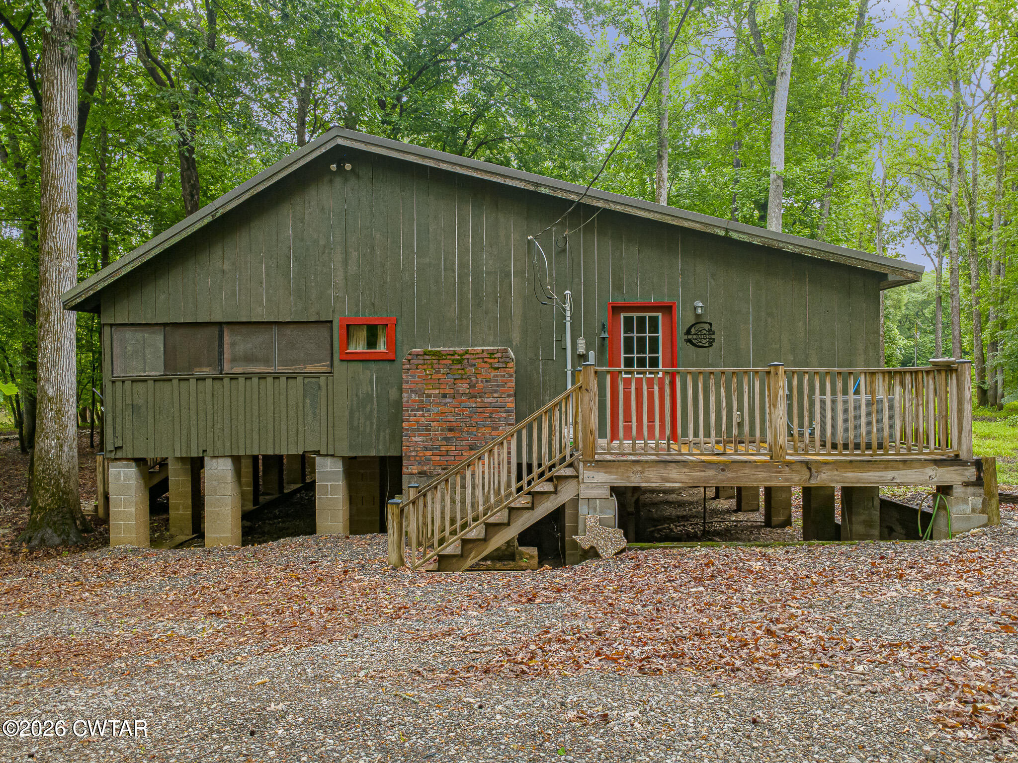 445 Wesley Lake Road Brownsville, TN 38012 - Photo 4 of 21 a backyard of a house with a yard and deck