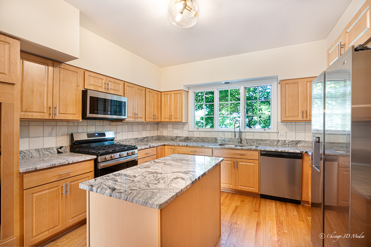 17 Longmeadow Road Winnetka, IL 60093 - Photo 16 of 46 a kitchen with a sink stove and microwave