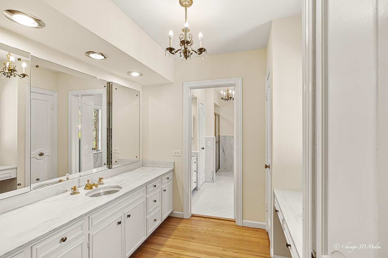 17 Longmeadow Road Winnetka, IL 60093 - Photo 19 of 46 a spacious bathroom with a double vanity sink mirror and shower
