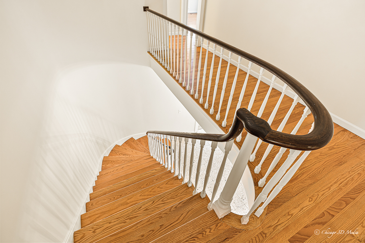 17 Longmeadow Road Winnetka, IL 60093 - Photo 20 of 46 a view of staircase with railing and white walls