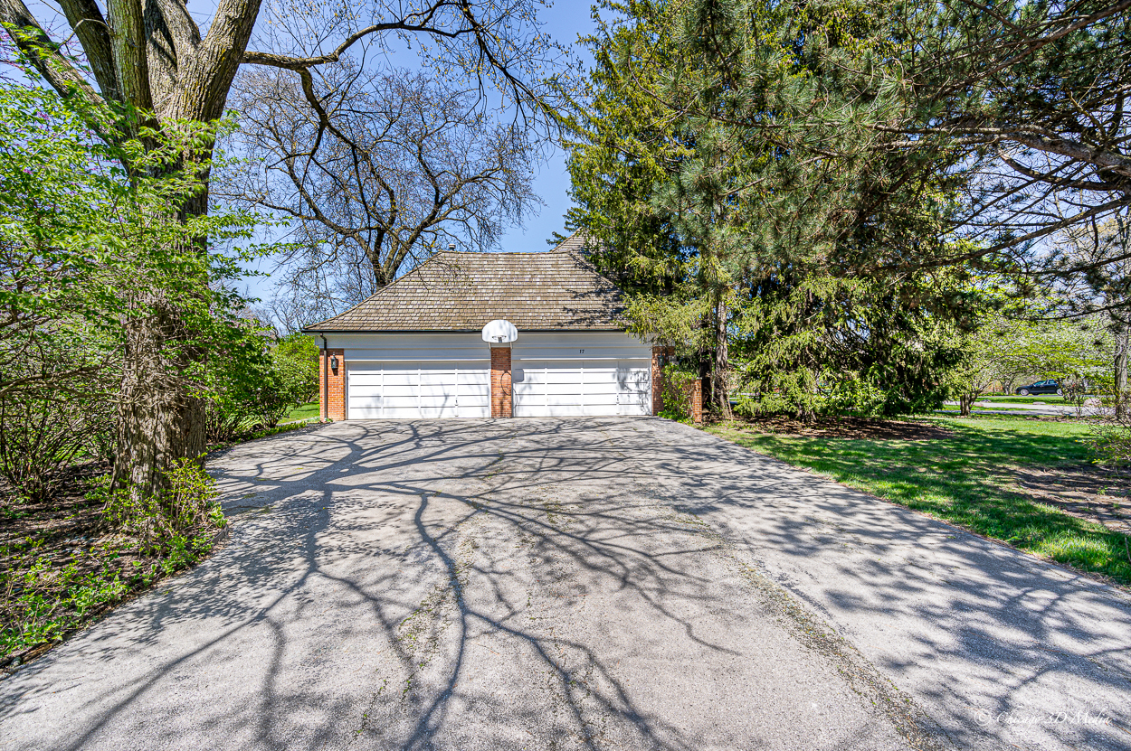 17 Longmeadow Road Winnetka, IL 60093 - Photo 28 of 46 a front view of a house with garden
