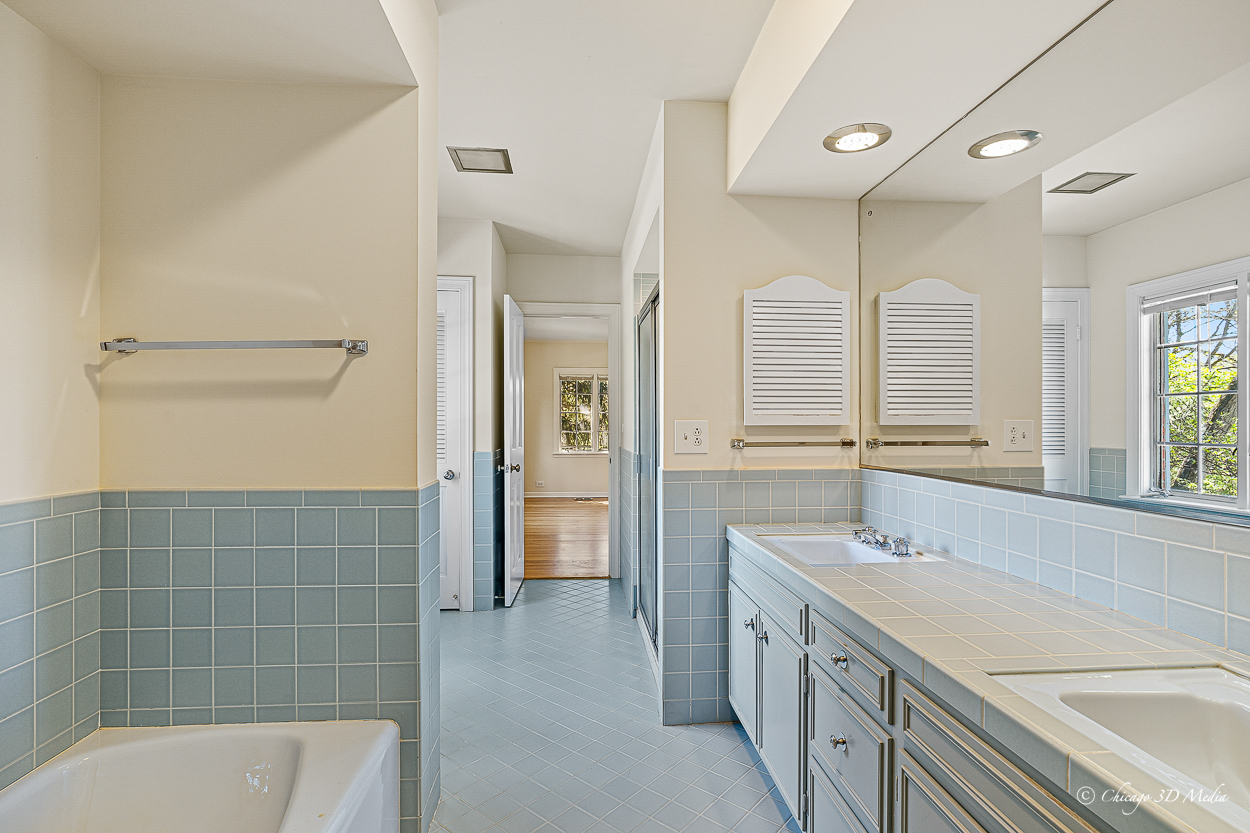 17 Longmeadow Road Winnetka, IL 60093 - Photo 40 of 46 a bathroom with a granite countertop double vanity sink a mirror and a bathtub