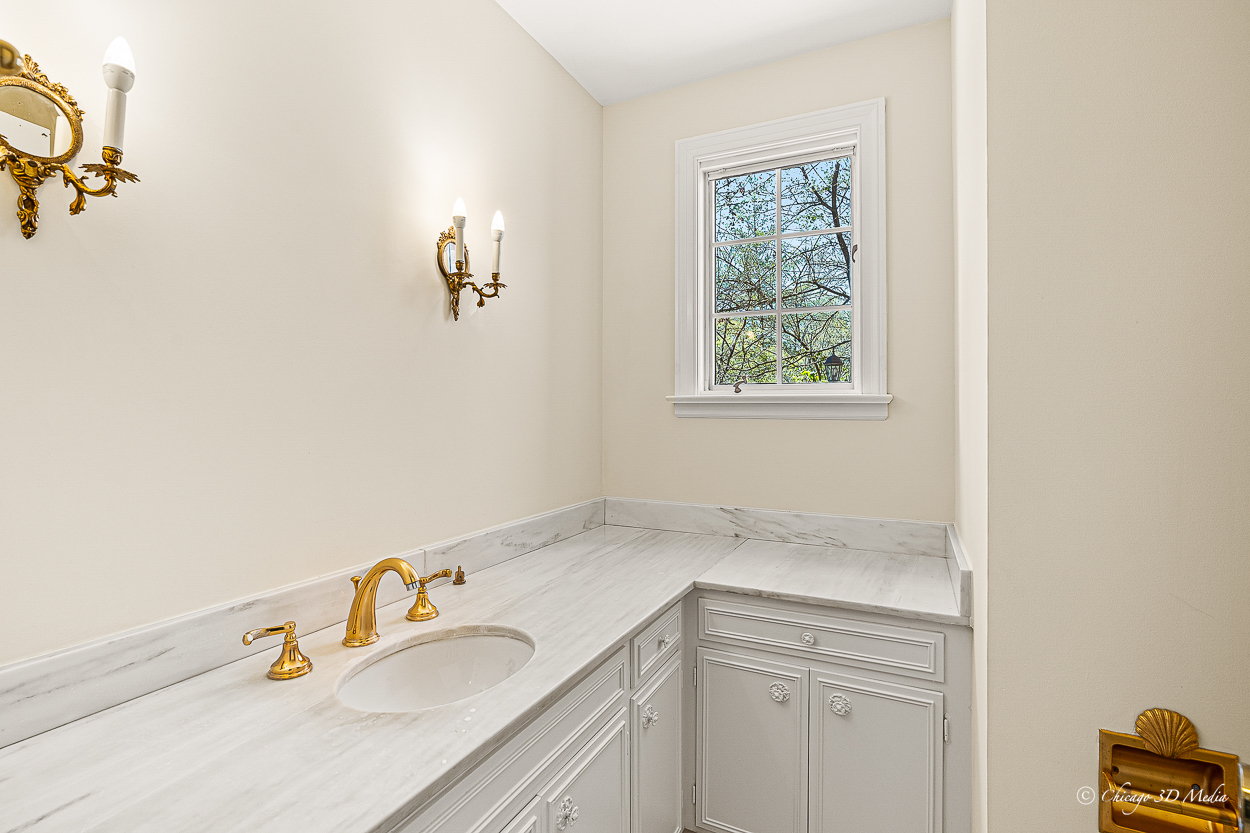 17 Longmeadow Road Winnetka, IL 60093 - Photo 43 of 46 a bathroom with a sink and a window