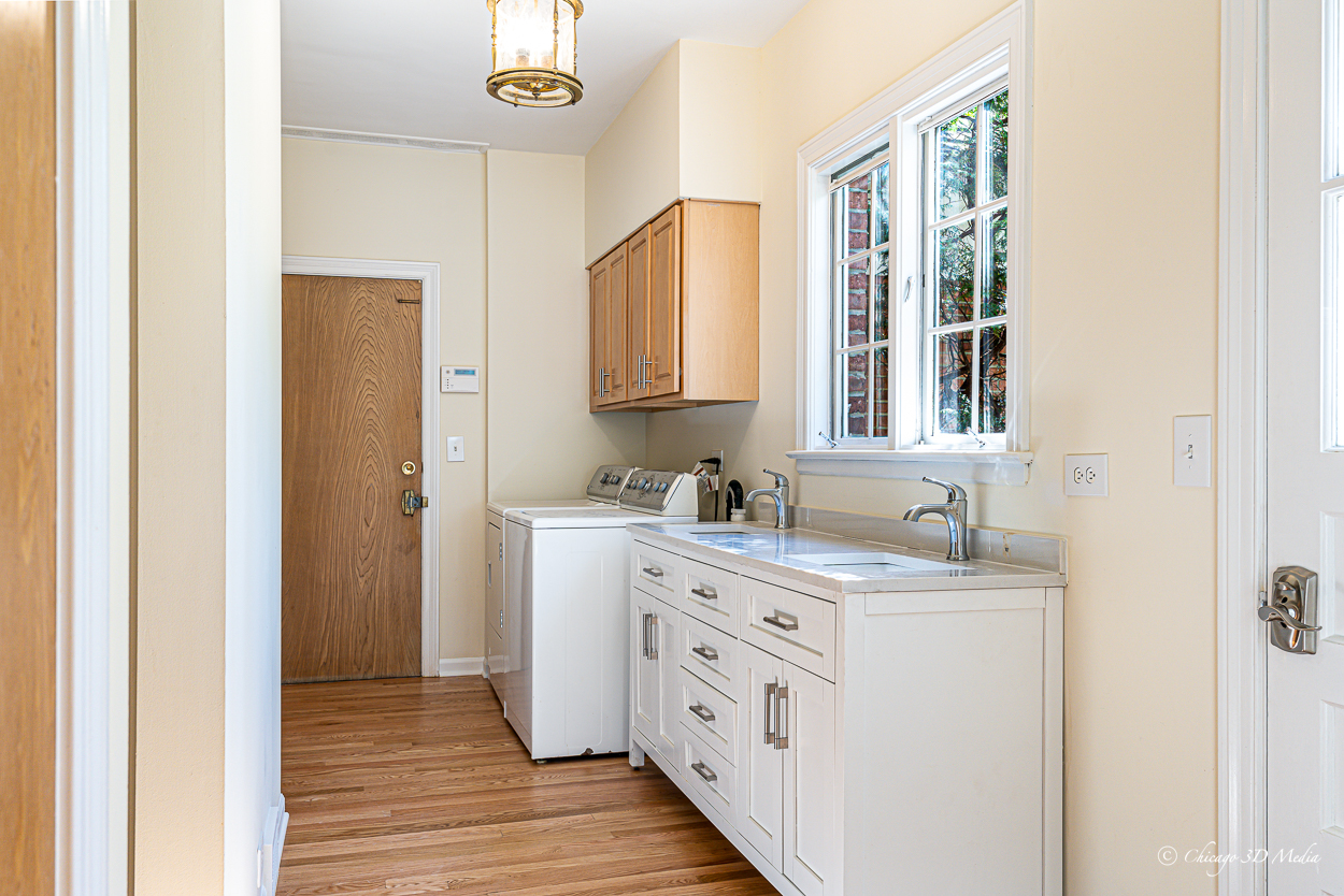 17 Longmeadow Road Winnetka, IL 60093 - Photo 44 of 46 a bathroom with a granite countertop sink a mirror and a shower