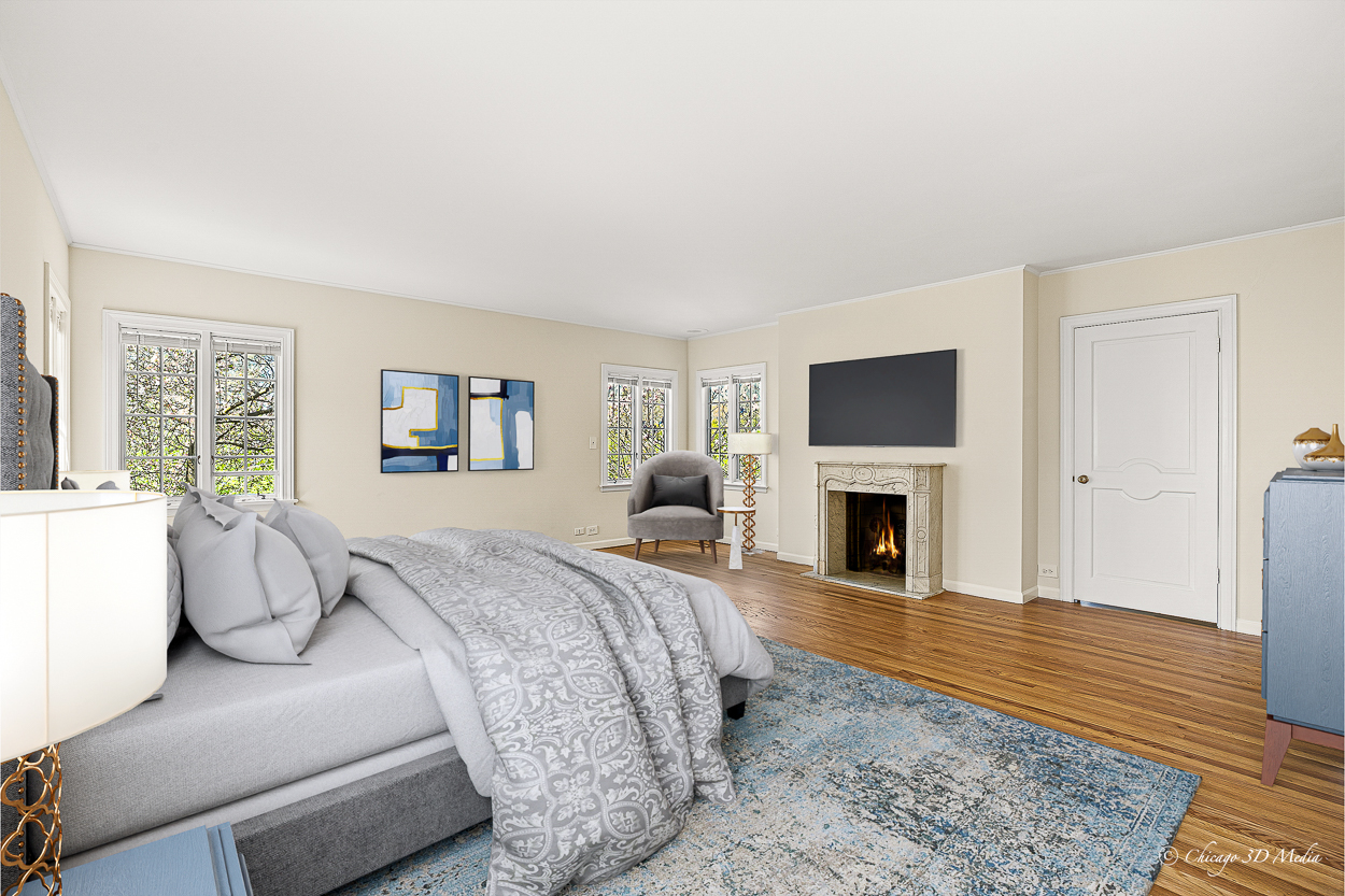 17 Longmeadow Road Winnetka, IL 60093 - Photo 10 of 46 a spacious bedroom with a balcony a bed and a fireplace