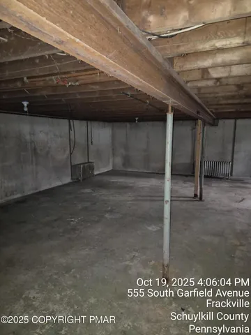 a kitchen with stove top oven and cabinets