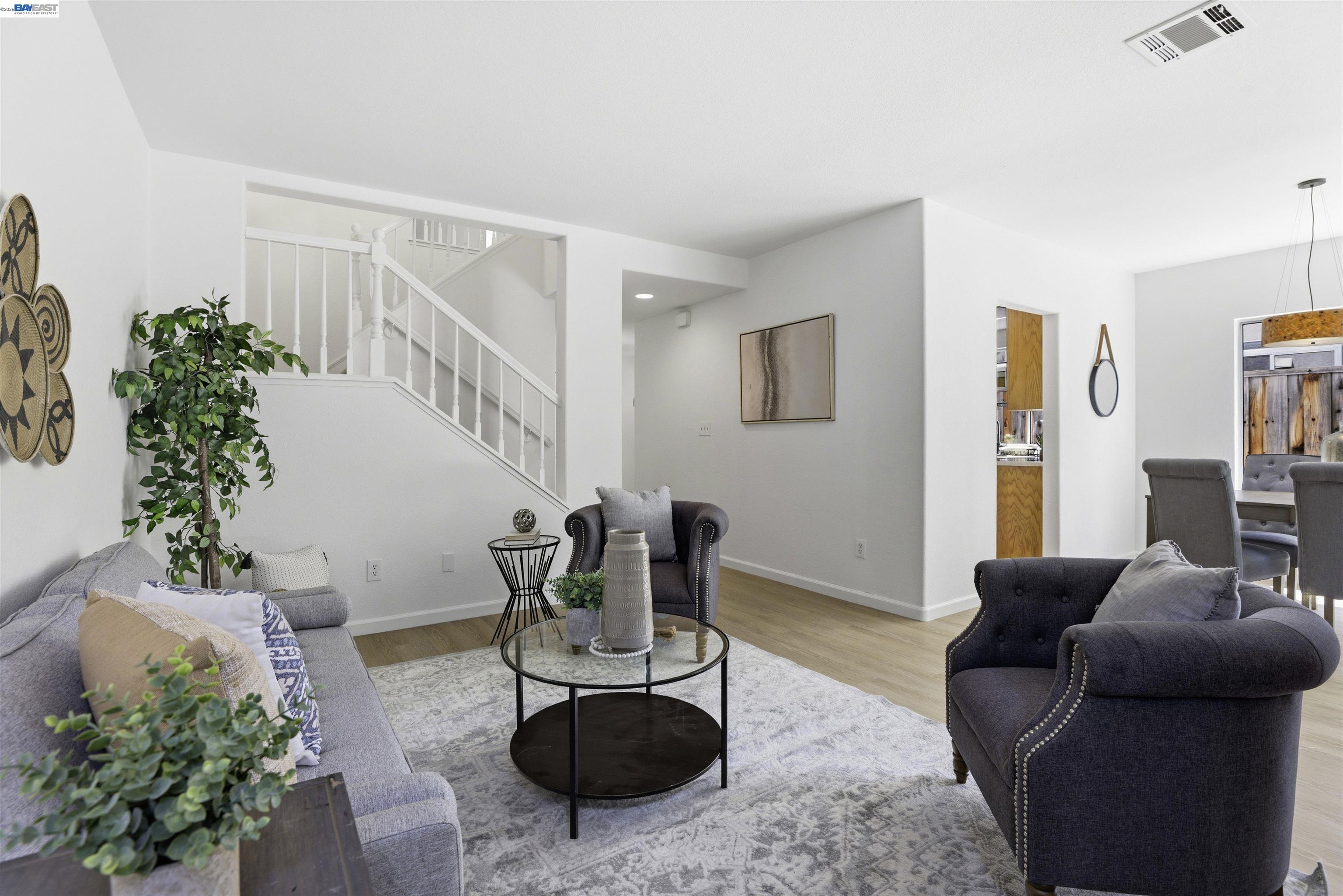 4161 Garibaldi Place Pleasanton, CA 94566 - Photo 12 of 47 a living room with furniture and a potted plant