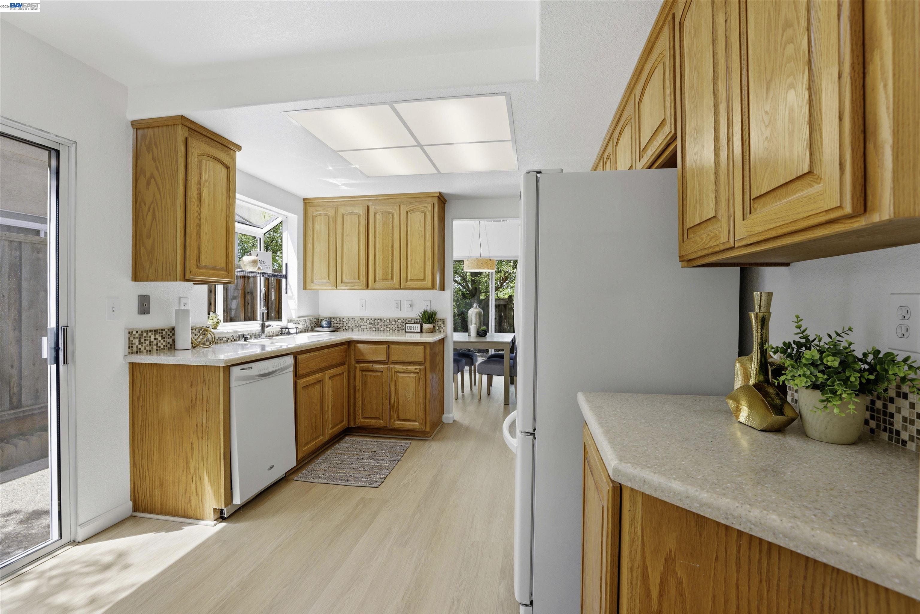 4161 Garibaldi Place Pleasanton, CA 94566 - Photo 14 of 47 a kitchen with a sink cabinets and window