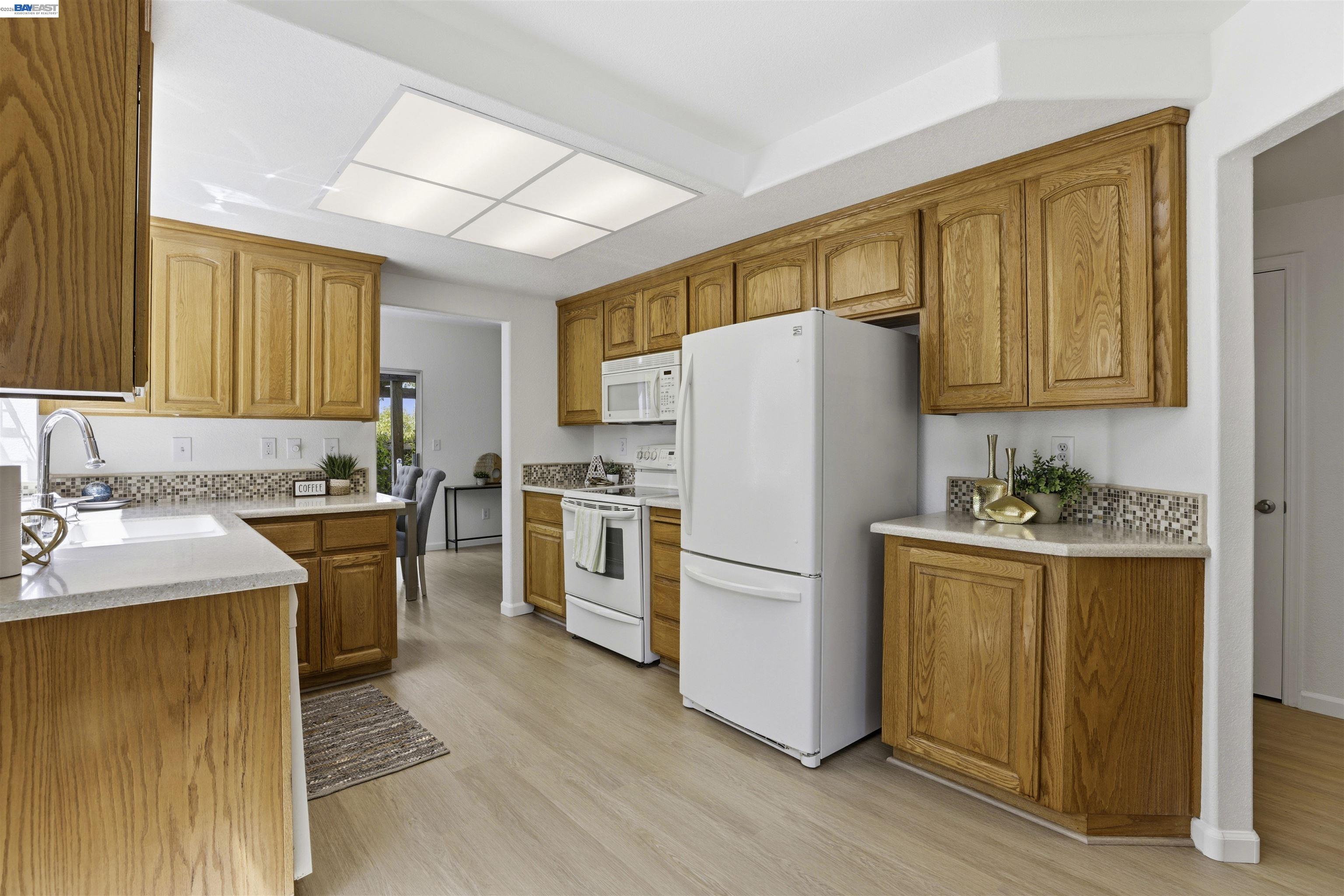 4161 Garibaldi Place Pleasanton, CA 94566 - Photo 15 of 47 a white refrigerator freezer sitting in a kitchen