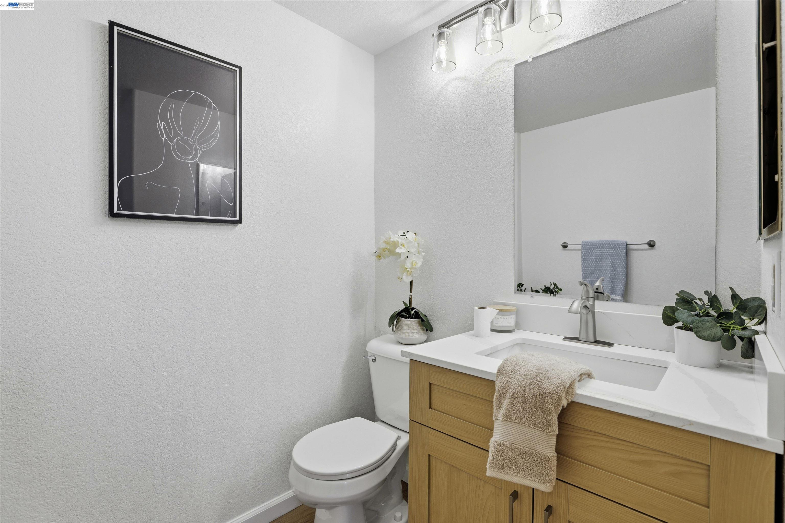 4161 Garibaldi Place Pleasanton, CA 94566 - Photo 19 of 47 a bathroom with a toilet sink and mirror