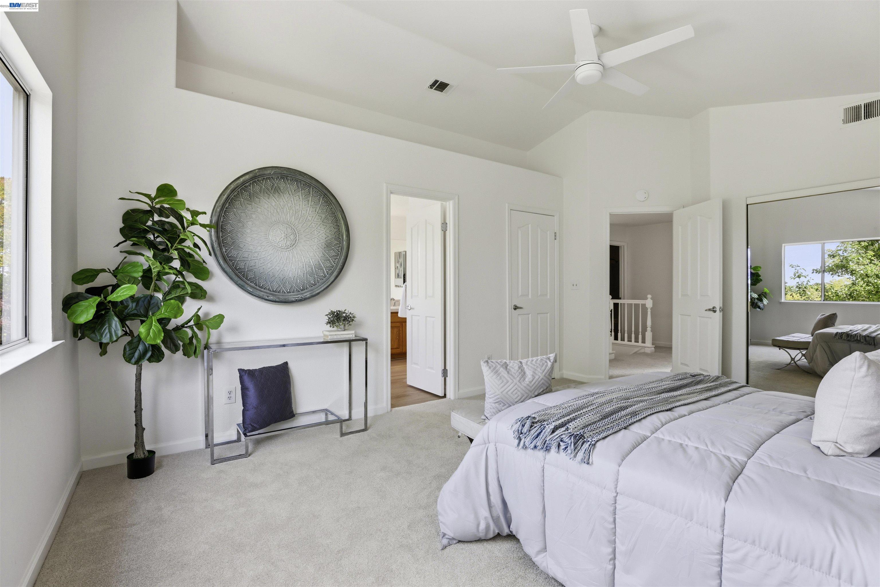 4161 Garibaldi Place Pleasanton, CA 94566 - Photo 24 of 47 a bedroom with bed and a chandelier