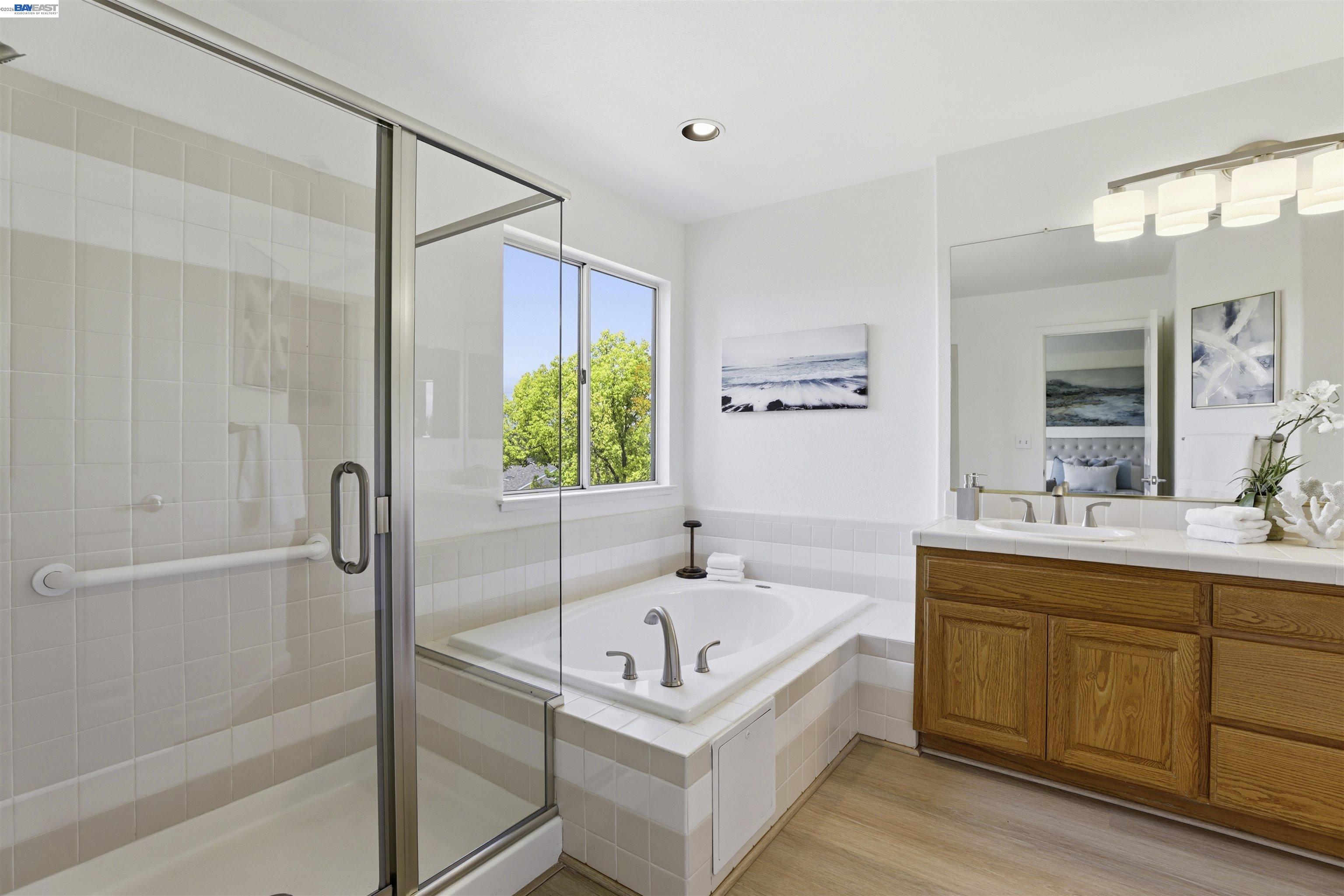 4161 Garibaldi Place Pleasanton, CA 94566 - Photo 26 of 47 a bathroom with a bathtub and a shower