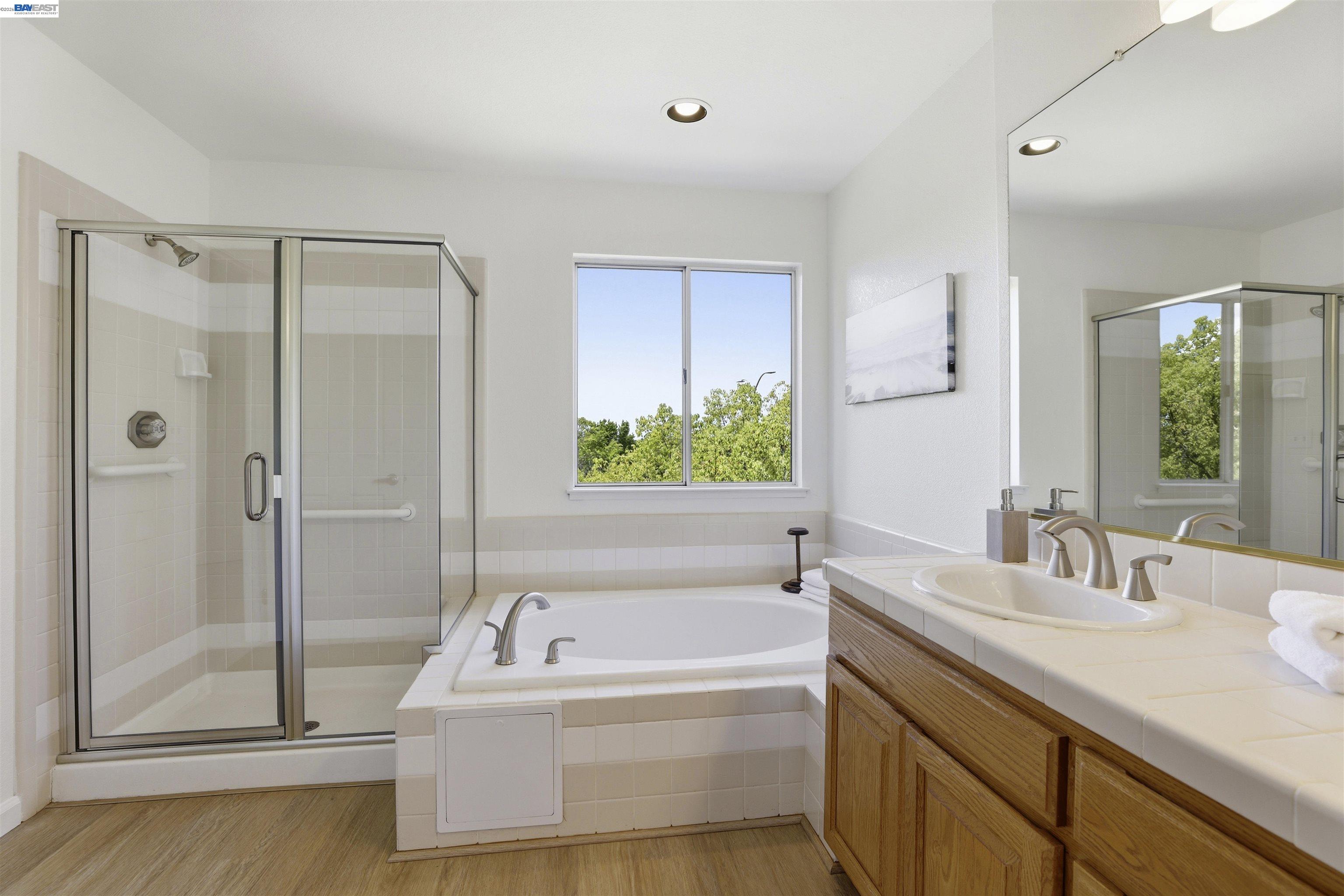 4161 Garibaldi Place Pleasanton, CA 94566 - Photo 27 of 47 a bathroom with a tub sink and mirror