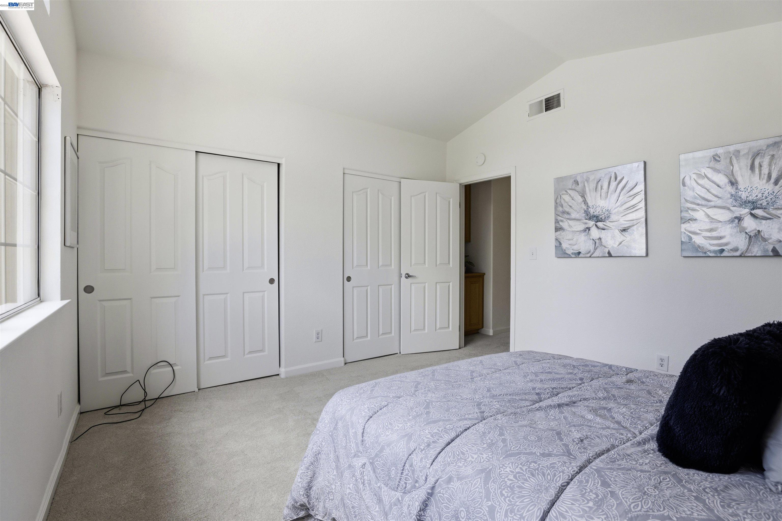 4161 Garibaldi Place Pleasanton, CA 94566 - Photo 33 of 47 a bedroom with a bed and a couch