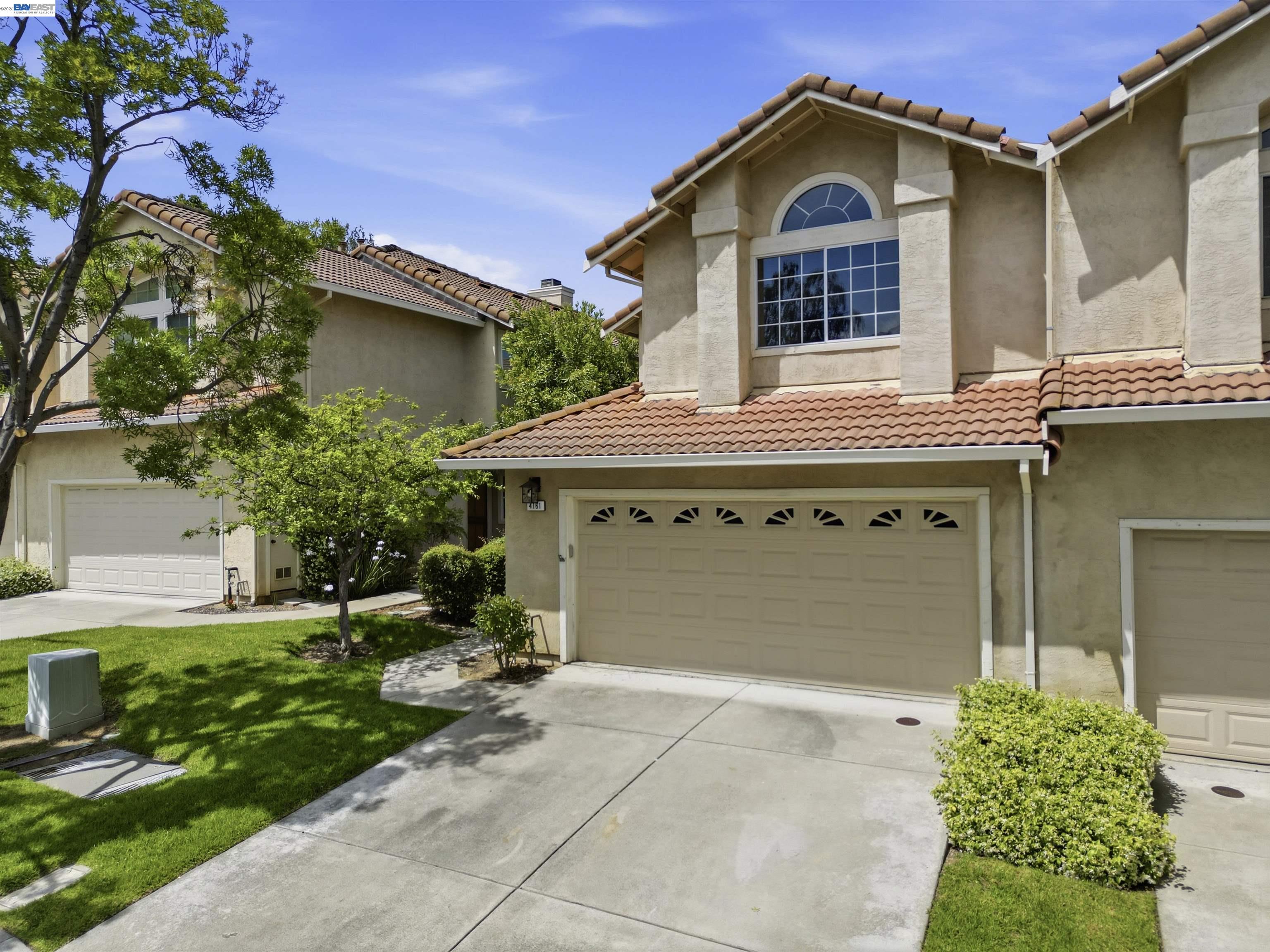 4161 Garibaldi Place Pleasanton, CA 94566 - Photo 4 of 47 a view of a house with a yard plants and large tree