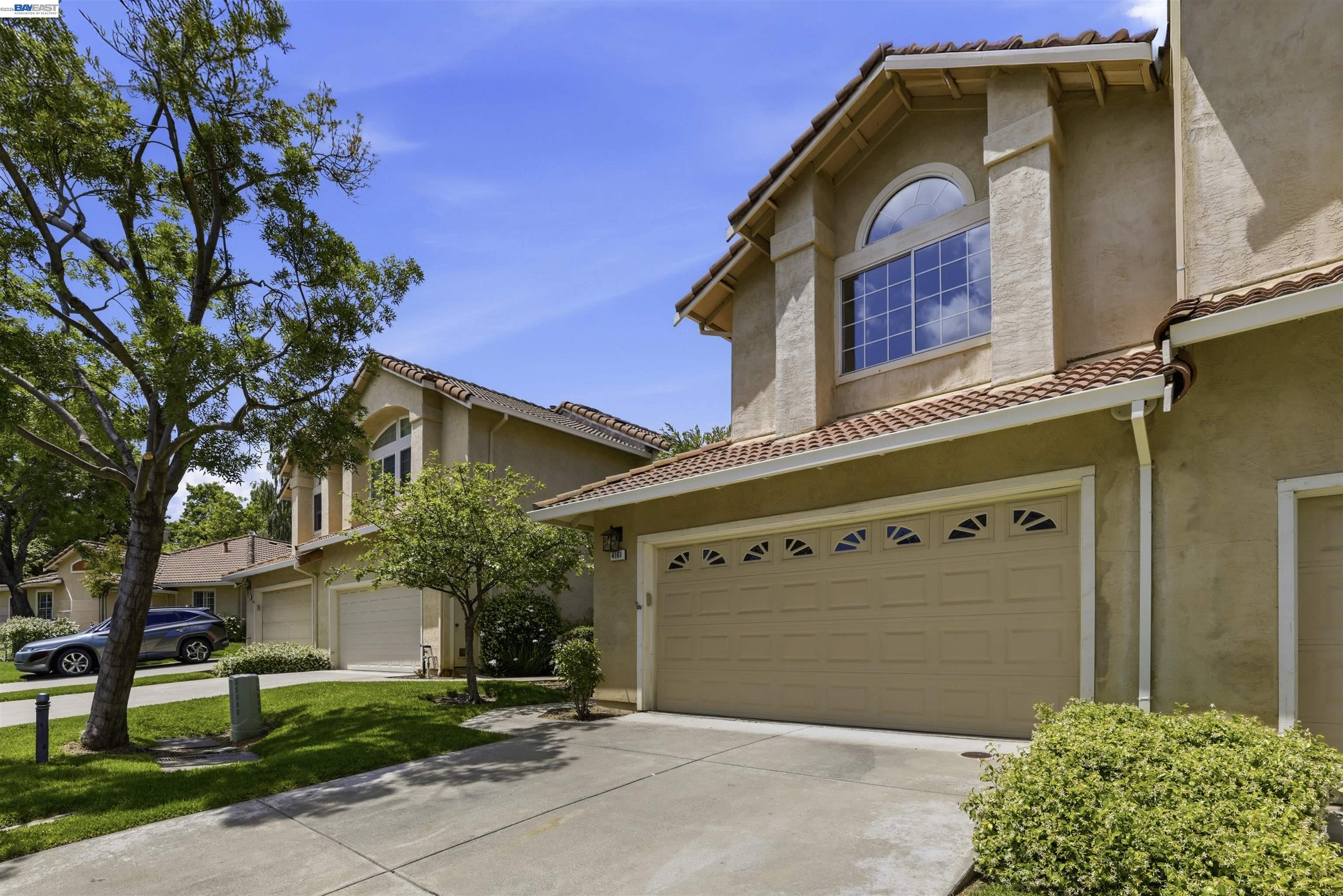 4161 Garibaldi Place Pleasanton, CA 94566 - Photo 5 of 47 a front view of a house with garden