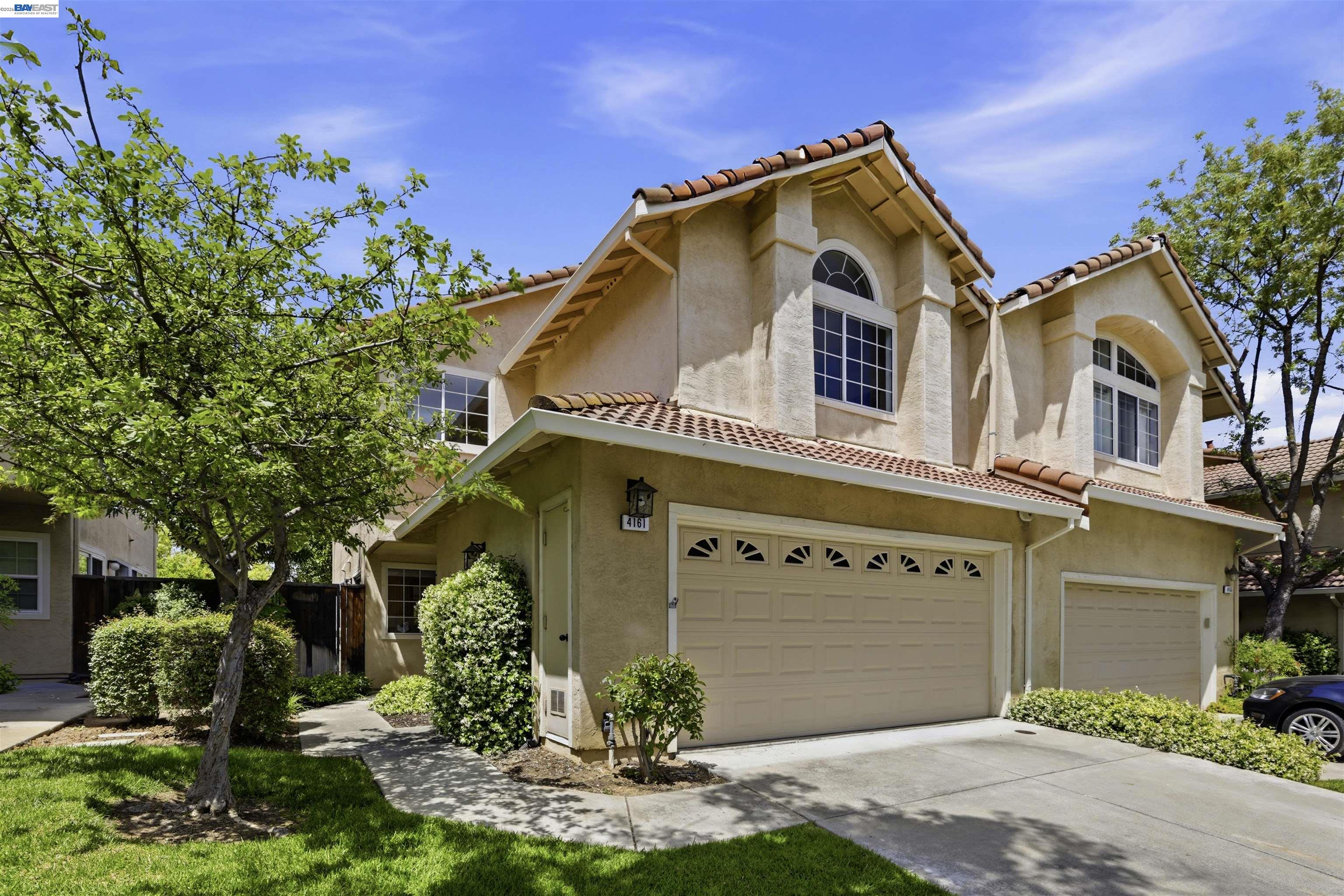 4161 Garibaldi Place Pleasanton, CA 94566 - Photo 7 of 47 a front view of a house with garden
