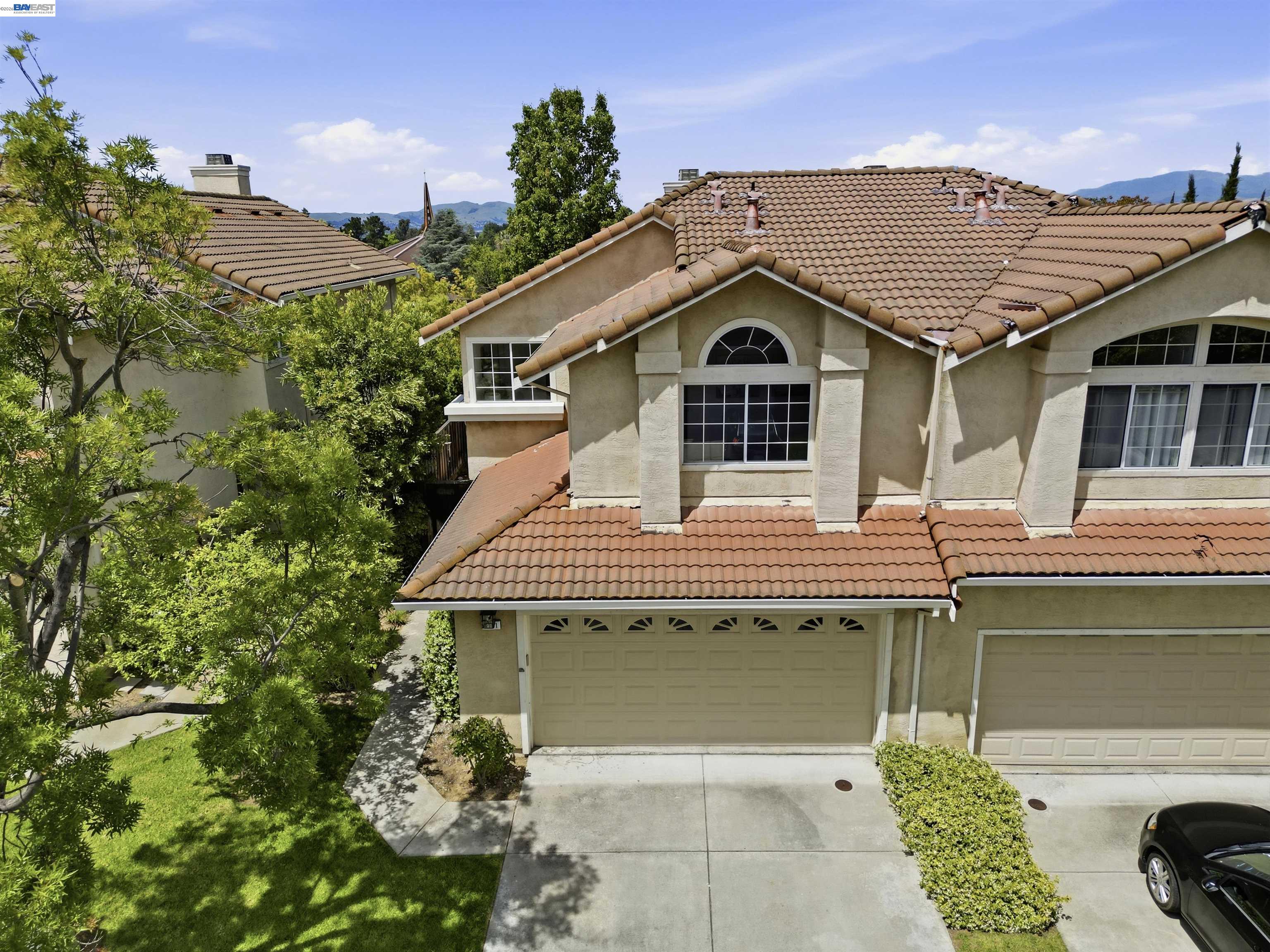 4161 Garibaldi Place Pleasanton, CA 94566 - Photo 8 of 47 a front view of a house with a garden